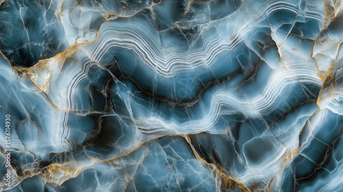 Abstract blue and white marble pattern with gold veins.