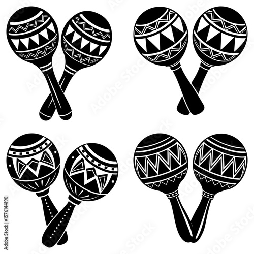 Four sets of black and white maracas with patterned designs arranged on a white background image view