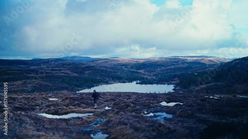 Wallpaper Mural Man Walking In Rural Landscape Of Reinsjøen, Norway - Wide Shot Torontodigital.ca