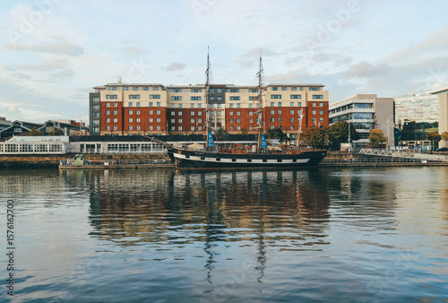 Photography dublin main river channel with big old museum ship at sunset