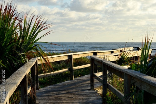 wooden bridge over the ocean