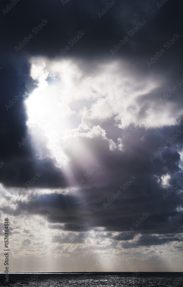 Fototapeta premium Weather background with the sun and clouds over the sea in San Sebastian, Euskadi