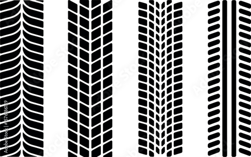 Four distinct black tire tread patterns on a white background
