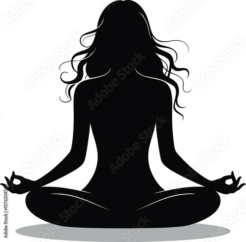 Silhouette of a woman with long flowing hair meditating in a lotus position