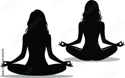 Two silhouetted women meditating in lotus pose with gyan mudra