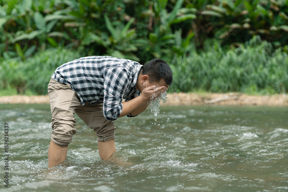 Fototapeta premium Man meditating with a feeling of river, nature and peace.