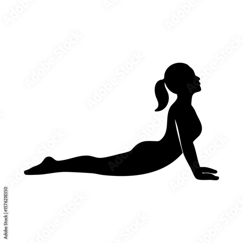 Silhouette of woman stretching upward in cobra pose yoga exercise