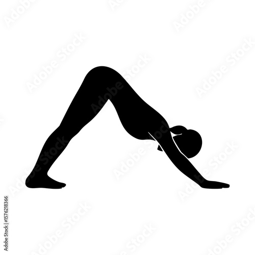 Silhouette of woman in downward dog yoga pose stretching full body
