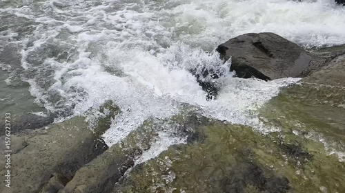 Calm River Flowing Over Rocks. Slow Motion Nature Scene