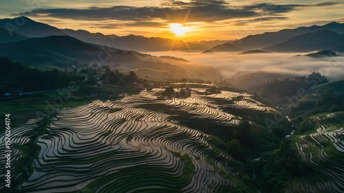 Rice Terraces of Yuanyang at Sunrise: A Breathtaking Aerial View with Foggy Mountains