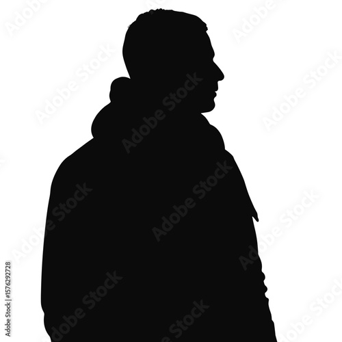 Silhouette of man standing in profile wearing hooded jacket  