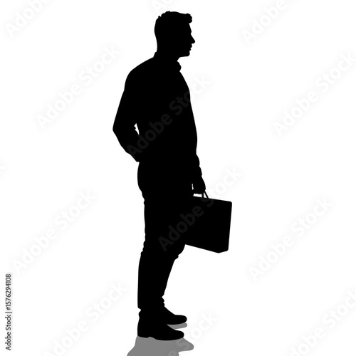 Silhouette of businessman standing with briefcase in profile view  