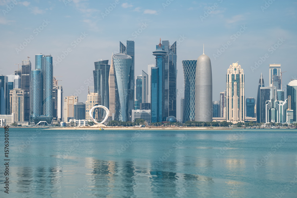 Fototapeta premium Panoramic view of the tall skyscrapers of Doha in Qatar. Persian Gulf countries. Doha skyline view with sea