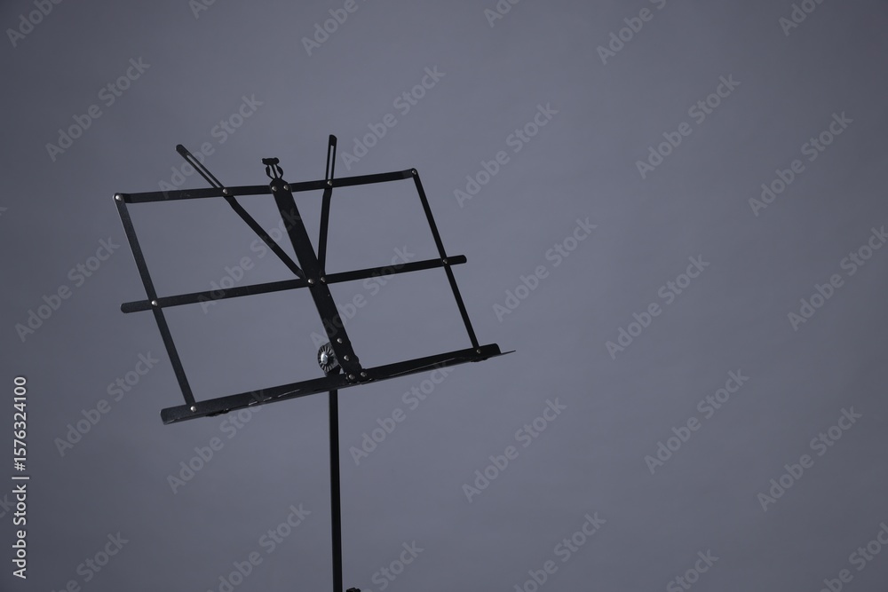 One empty note stand on grey background, space for text One empty note stand on grey background, space for text