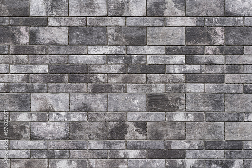Background texture of a gray decorative brick wall