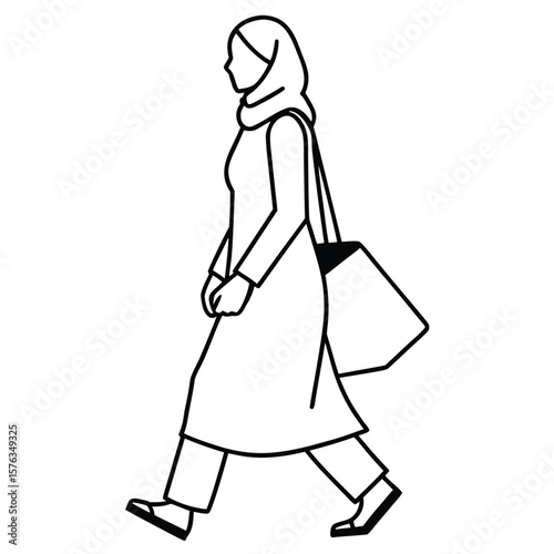Woman wearing a hijab and long coat walking with a shopping bag silhouette