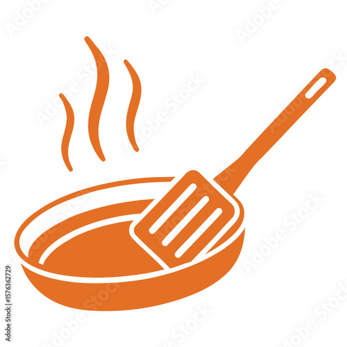 Orange frying pan with spatula and steam cooking