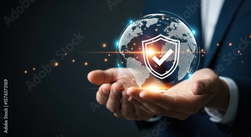 A person holds a digital globe with a shield and check mark, symbolizing global cybersecurity and data protection