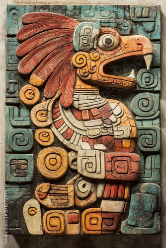Carved stone relief depicting an ancient bird-like figure with intricate details.