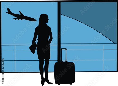 Silhouette of a man and woman with suitcases at airport terminal window