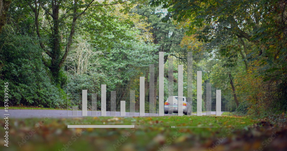 Fototapeta premium Showing silver sedan occupying frame on forest road, with faint bars and timeline slider overlay