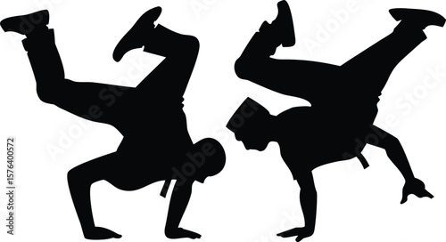 Breakdancers Silhouette Performing Handstand Freeze Moves