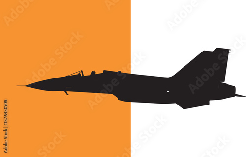 Silhouette of a modern military jet aircraft against orange and white background