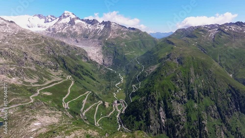 The beautiful winding road, Aerial view of the road to Furkapass in the Swiss Alps, Kanton Wallis , mountain road. The ice-free bed of the Rhone Glacier, Alpine panorama, Landscape of the Swiss Alps