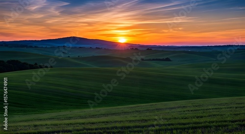  Rolling hills under a colorful sunset.jpg