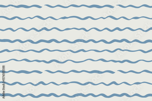Blue painted waves create an elegant, flowing pattern perfect for backgrounds and artistic designs, evoking an oceanic serenity.
