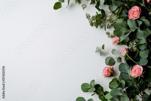 Floral Arrangement With Eucalyptus and Pink Roses on Light Background Creatin...