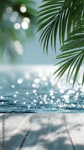 Bright Tropical Palm Leaves and White Flowers Beside a Sparkling Blue Swimmin...