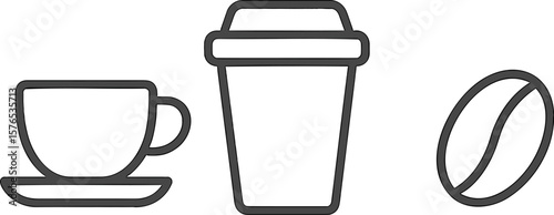 Hot beverage options on a minimalist table with a coffee bean in focus and a takeaway cup at morning time