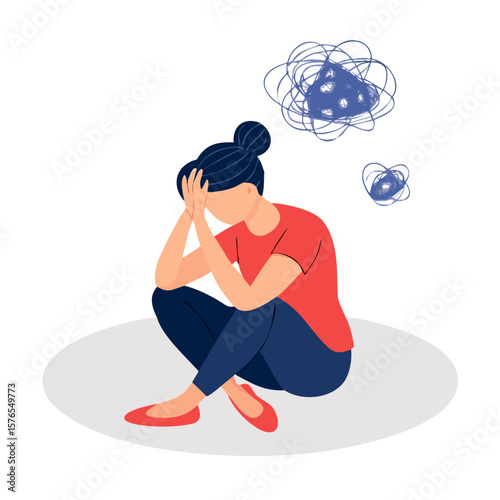 A woman sitting with her head in her hands, looking stressed