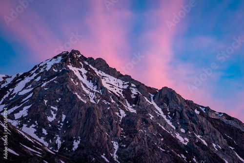 Alpenglow on Snow-Dusted Sierra Peak at Dusk