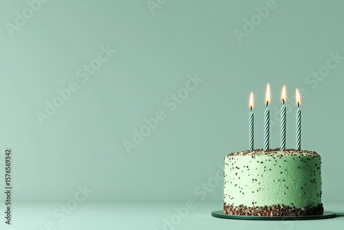 Celebrate With a Mint Chocolate Birthday Cake Featuring Four Lit Candles on a...