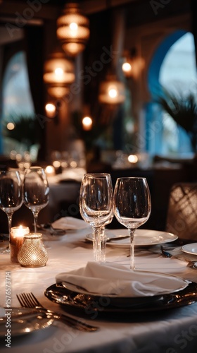 Elegant Dining Setup With Candles and Wine Glasses in a Cozy Restaurant at Dusk