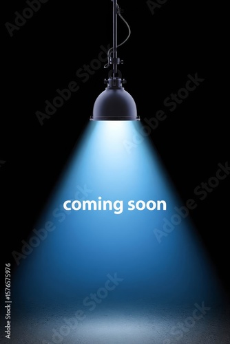 Spotlight shining on dark background with coming soon text.