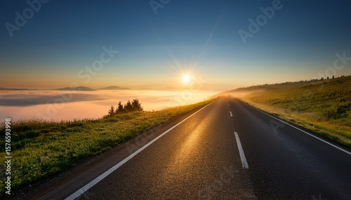keep climbing leads to a bright horizon over a misty road at sunrise
