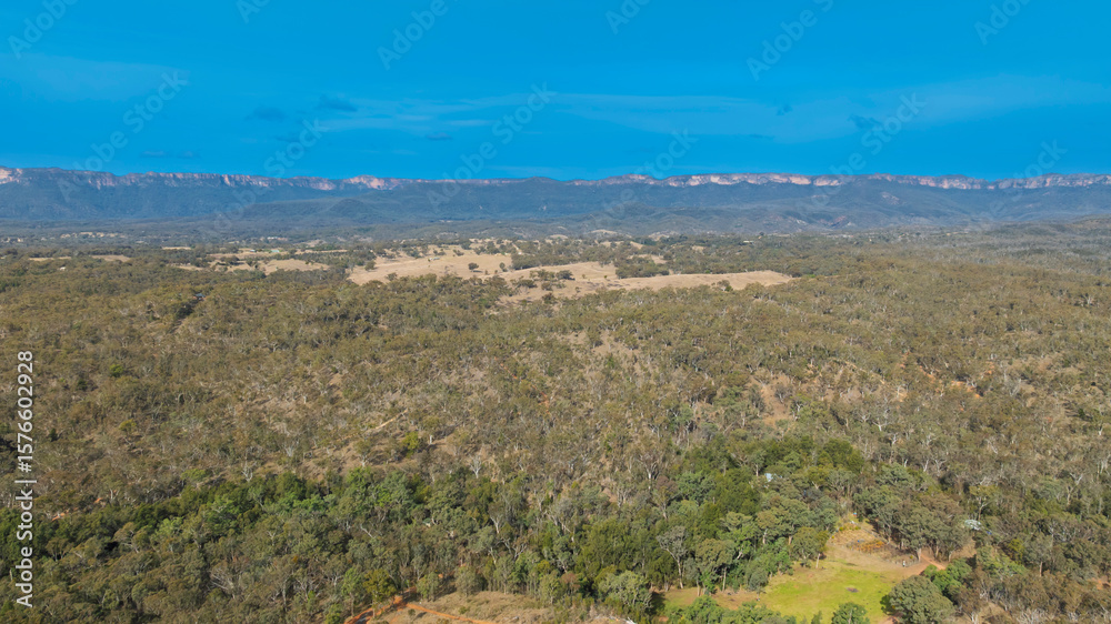 Fototapeta premium Drone aerial photograph of the widest canyon in the world the Capertee Valley in Wollemi National Park in the Central Tablelands of NSW, Australia.