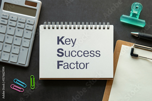There is notebook with the word Key Success Factor. It is as an eye-catching image.