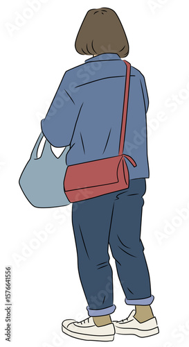 立ち止まる後ろ姿の女性