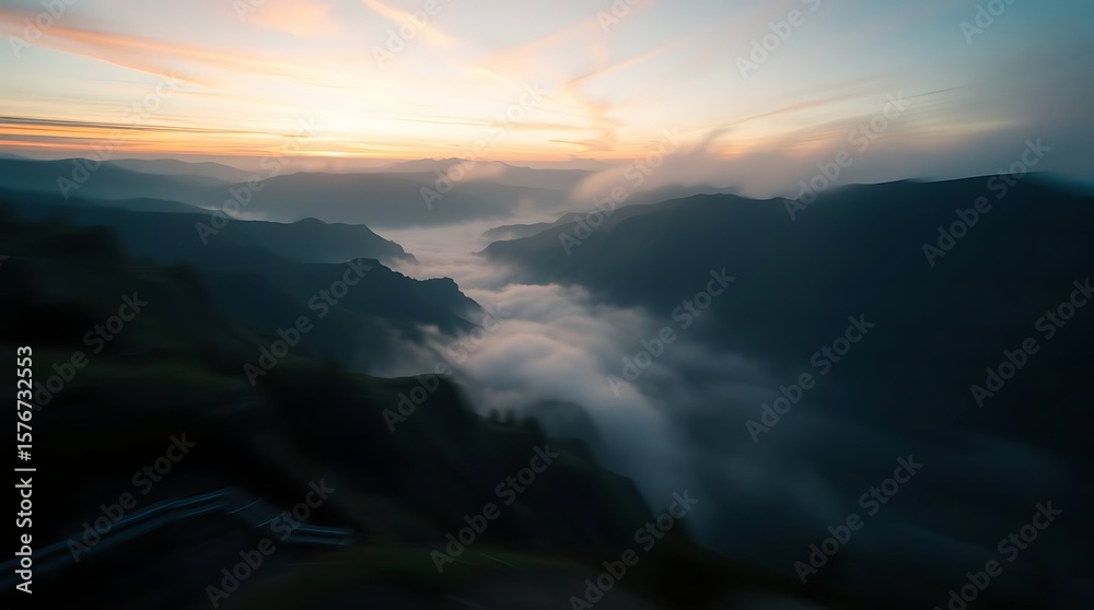 Fototapeta premium Misty valley sunset layered mountains landscape