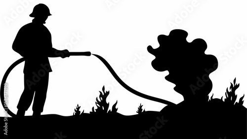 Silhouette of firefighter putting out a fire with a hose in a field with smoke and flames visible