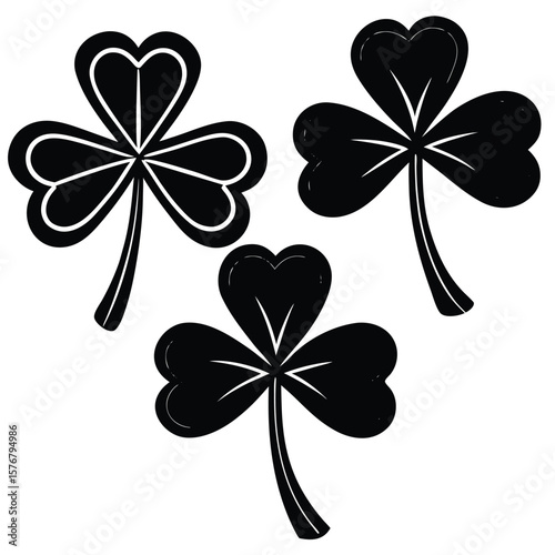 Three stylized black shamrocks with white outlines and internal lines arranged in a triangular formation on a white background silhouette