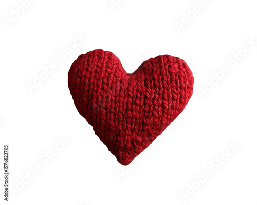 Knitted heart on aged paper and wood