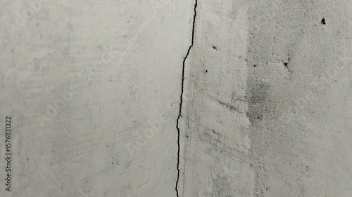 the house wall is cracked. The crack was caused by extreme weather