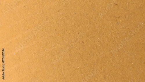 Background of brown kraft paper or cardboard texture. Abstract pattern of beige rough carton, old paper sheet, parchment or papyrus surface.