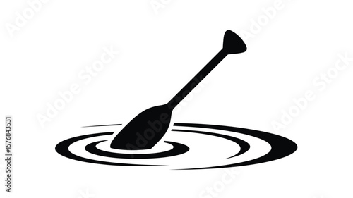 Black silhouette of a paddle moving through rippling water surface