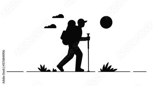 Silhouette of a hiker with a backpack and trekking pole walking under the sun and clouds